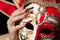 Fashionable stilettos nails design with Venetian buffoon mask