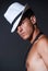Fashionable topless male with white fedora