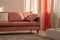Fashionable velvet pastel pink couch in white living room interior with trendy design