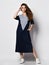 Fashionable woman in a beautiful long blue dress with a light insert, sneakers. Fashion spring summer autumn photo