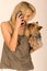 Fashionable woman with cell phone and dog