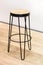 Fashionable wooden high chair for restaurant bar, forged black metal frame