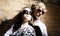 Fashionable young couple wearing sunglasses