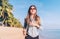 Fashionable young longhaired woman have morning jogging on the seaside beach