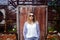 Fashionable young woman posing outside against grunge background