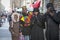 Fashionably dressed people listening to street musicians on Brick Lane