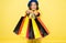 Fashionista adore shopping. Obsessed with shopping. Girl cute kid hold shopping bags on yellow background. Mid season