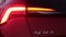 A fast blinking animated turn signal of headlight of a red car Skoda Scala, December 2021, Prague, Czech Republic