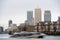 Fast boat on Thames, London; Canary Wharf at back