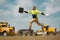 Fast building. Funny construction worker jumping. Excited jump of builders in helmet. Worker in hardhat. Construction