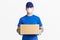 Fast delivery parcels. Courier in blue uniform