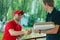 Fast delivery service shaking hand of male client