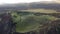 Fast flight over green volcanic crater