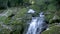 A fast flowing alpine waterfall.