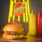 fast food concept of hamburger with two bottles of sauce on neon burger light in night cafe