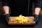 Fast food dish salted french fries wooden board