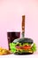 Fast food frame. Delicious meat burgers on pink background. Take away meal. Unhealthy diet concept with copy space