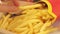 Fast food from McDonald\\\'s. Close-up woman\\\'s hands take french fries