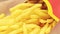 Fast food from McDonald\\\'s. Close-up woman\\\'s hands take french fries