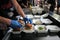 Fast food preparation of hamburgers in an outdoor market in London England