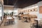 fast-food restaurant with minimalist decor, clean lines and a mix of natural and artificial lighting