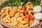 Fast Food Snack Basket with Onion Rings and Falafel