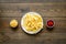 Fast food symbol. French fries on plate on dark wooden table top-down