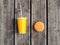 Fast food and unhealthy eating concept - juice cup with hamburger on a wooden table background