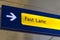 Fast Lane sign in blue and yellow at the airport