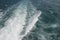 Fast motorboat with splash and wake on an ocean