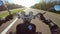 Fast motorcycle riding on highwa towards sun, wide point of view of rider. Classic cruiser/chopper forever!