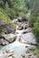 The fast mountain river which is flowing down from stones in Abkhazia