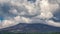 Fast moving clouds over the Etna volcano in Sicily, Italy