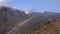 Fast moving fog and mist on rocky terrain near summit of Asahidake