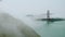 Fast moving fog rolls over the Marin Headlands with Golden Gate in background