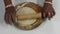 Fast moving hands of a woman preparing roti at wooden belan chapati board in kitchen