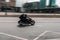 Fast moving Indian Scout motorcycle on highway with blurred background. Motorcyclist riding a new bike on high speed. Exceeding