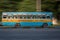 A fast moving public bus with passengers on streets of Kolkata, Calcutta, West