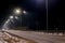 Fast moving traffic at night. Timelapse. winter season. concept of the road, snow and ice removal, danger and safety of movement,