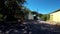 Fast shot through village road in Monchique, passing by houses and trees and vegetation.