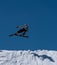 Fast skier flying through the air