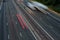 Fast traffic speeding along the M40 motorway in Buckinghamshire. Light trails from long exposure.