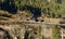 fast train and old chalet on a sunny slope near Wassen , Switzerland