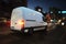 Fast van on a city road delivering at night. 3D Rendering