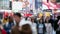 Fast view of anonymous urban crowd of commuters, unrecognizable tourists  walking in Manhattan, NYC. 5th Aveue. Blurry Background