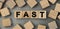 FAST - word concept from wooden blocks. Top view