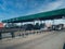Fastag enabled toll booth plaza and toll gates with traffic lined up in each gate