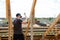 Fasteners and installation of roof rafters by workers. Preparation for laying slate. Construction and installation