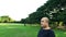 Fat bald head Asian Thai man swinging his arm warming up before his fitness exercise workout in natural outdoor park landscape in