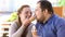 Fat boyfriend and girlfriend enjoying ice-cream dessert, overeating sweets